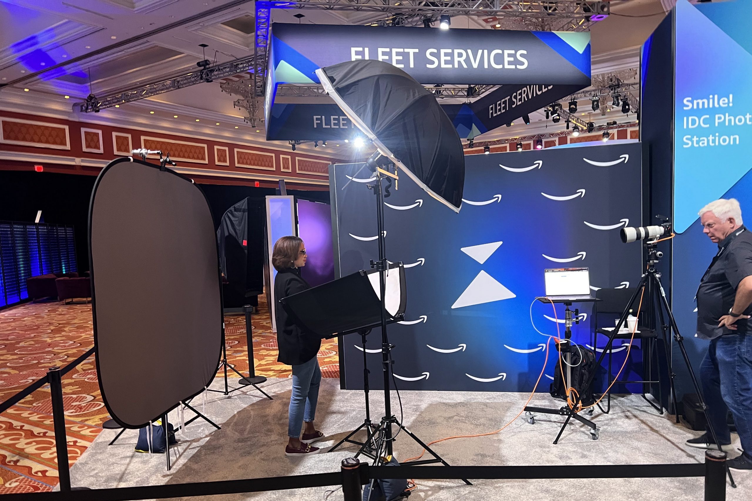 Conference attendee receiving professional headshot during annual meeting