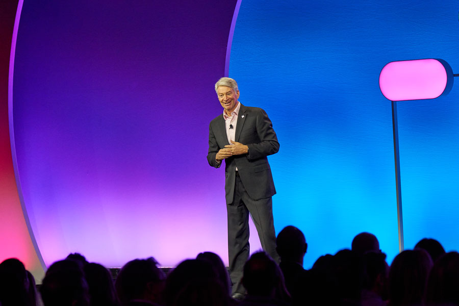 Corporate keynote speaker presenting during annual meeting conference