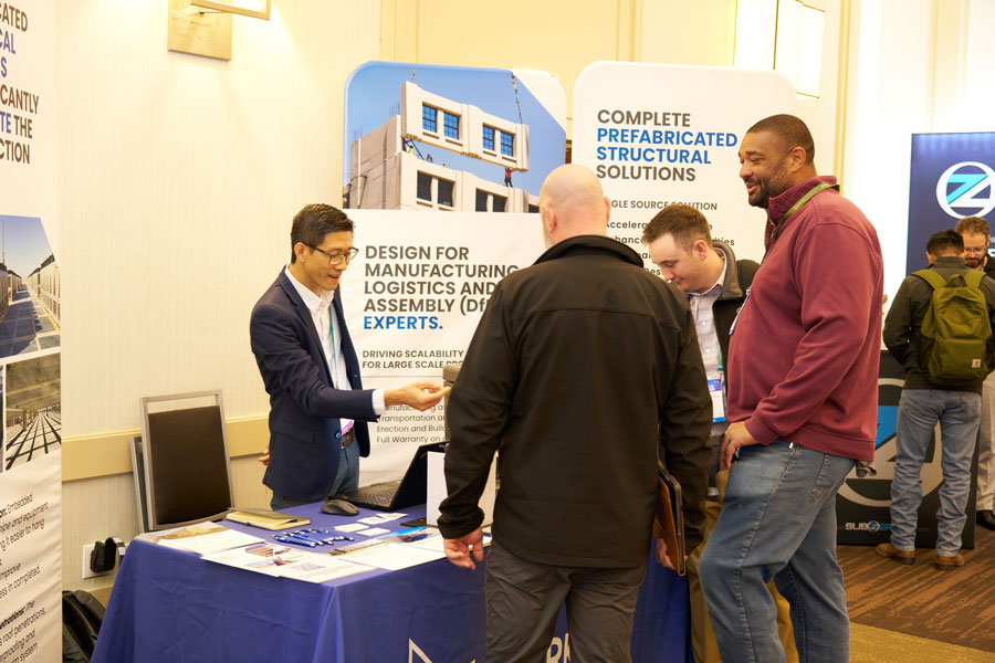 Attendees engaging with exhibitor booth during corporate trade show in Utah