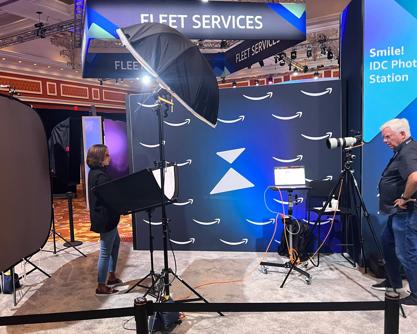 Professional headshot station set up inside a branded trade show exhibit