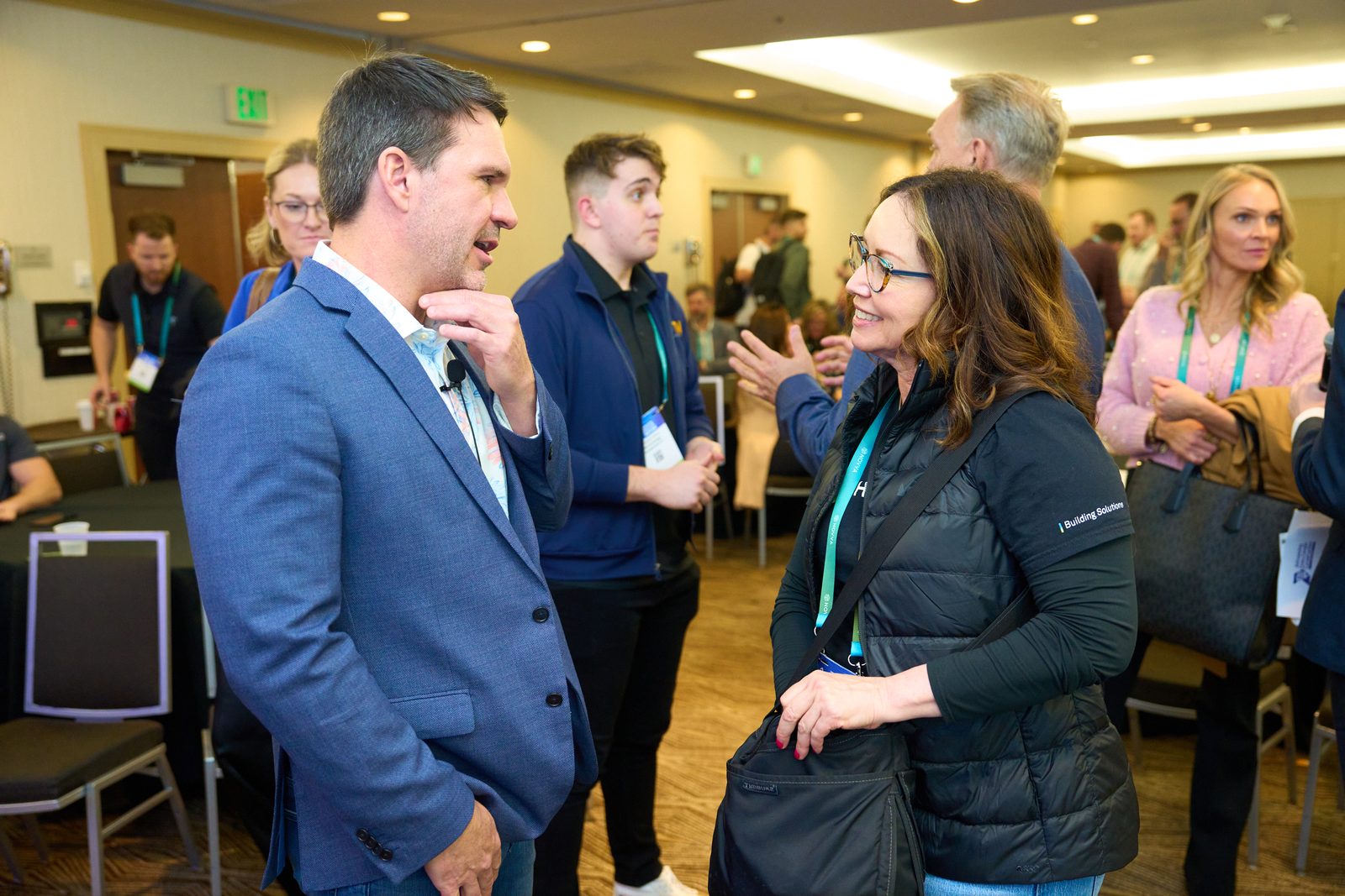 Attendees talking after a conference session