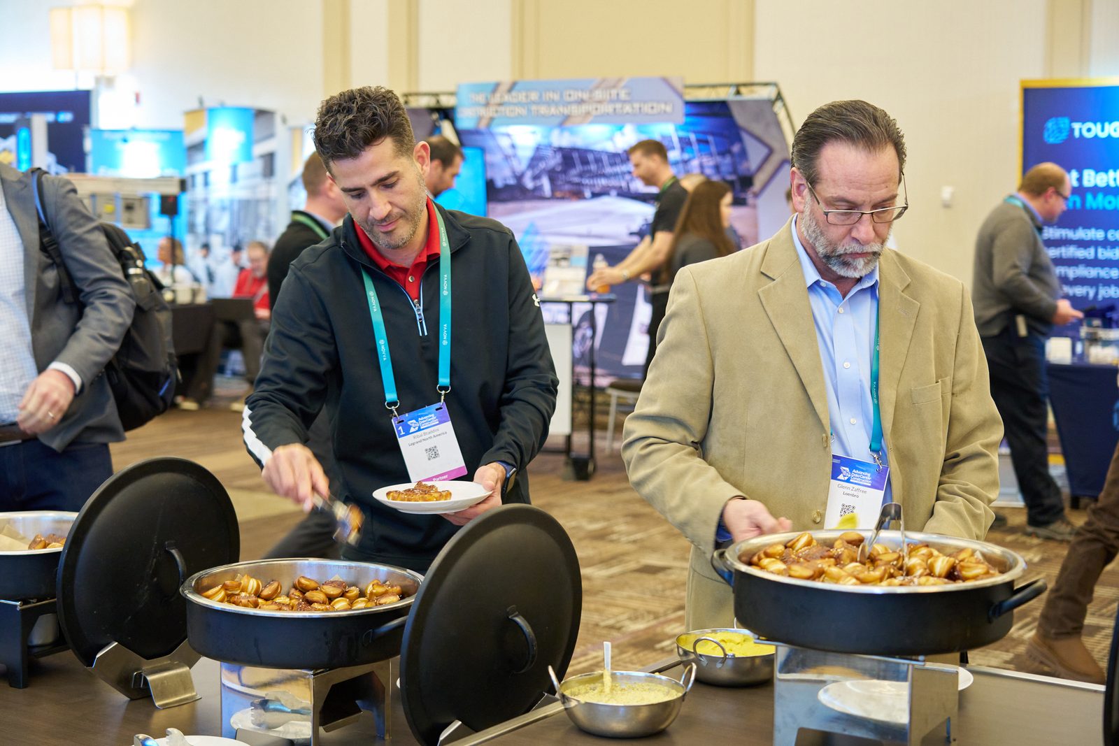 Attendees at the networking break buffet